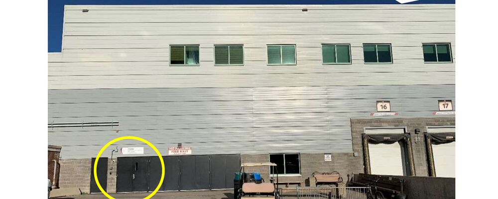 Photo of the BMO loading docks. The employee door, Door 21, is circled.