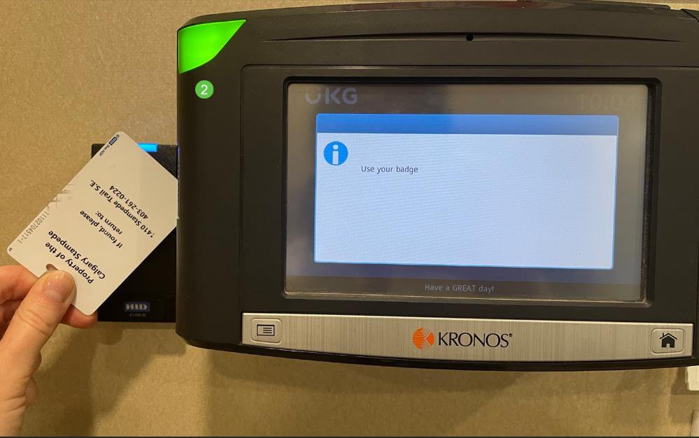 Kronos timecard reader showing where to place your badge